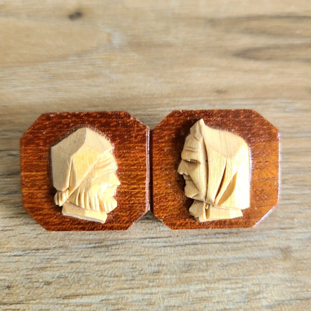 Vintage hand carved wooden brooch/pin depicting man and women.